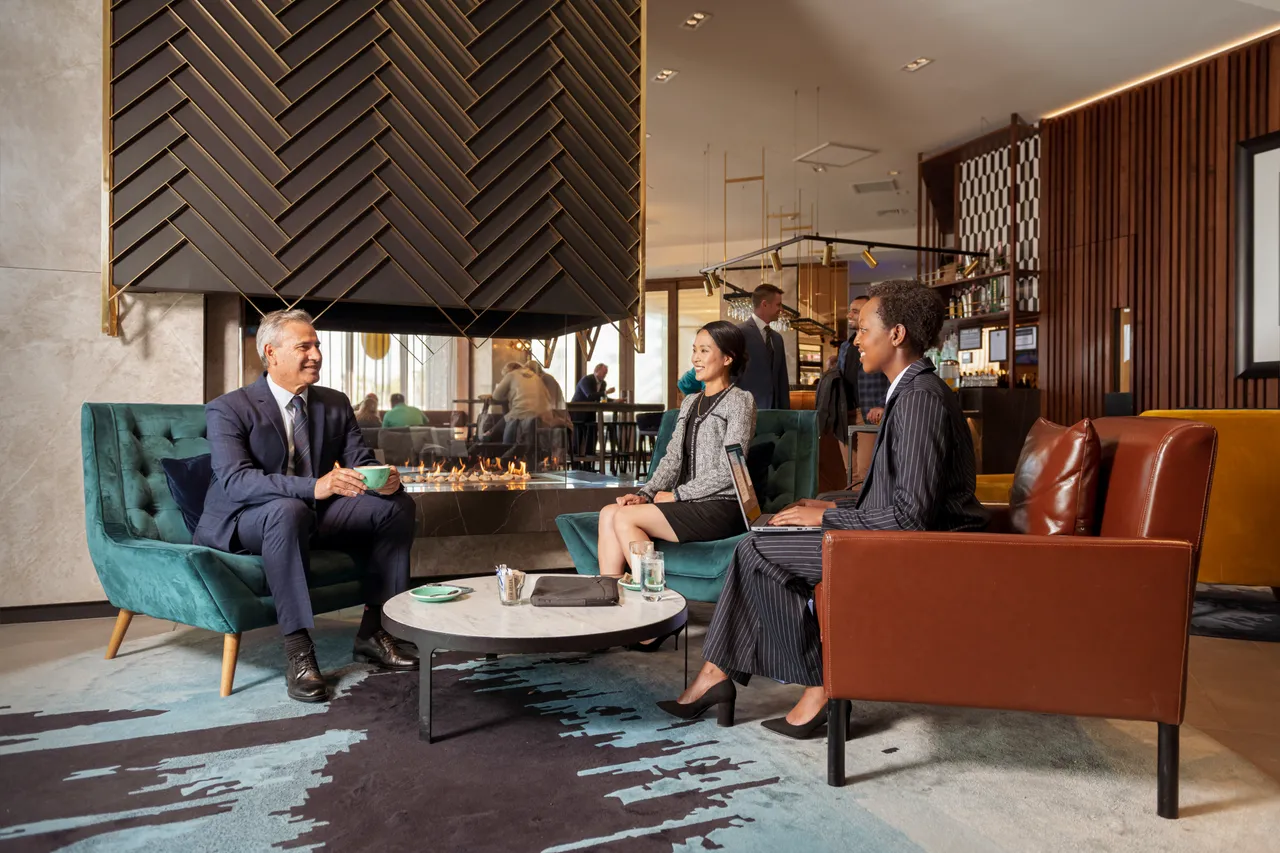 Delegates in hotel lobby