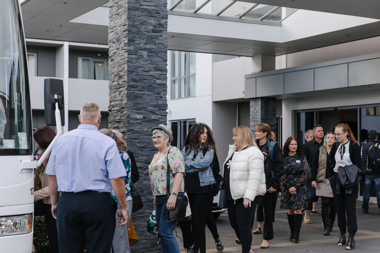 Meet Famil - Group Boarding Bus ScenicNZ