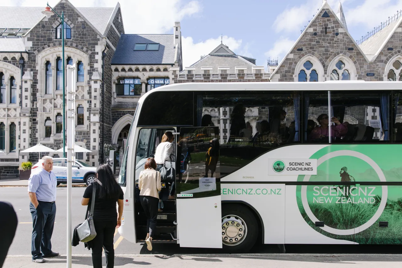 Meet Famil - Boarding Coach Outside Arts Centre