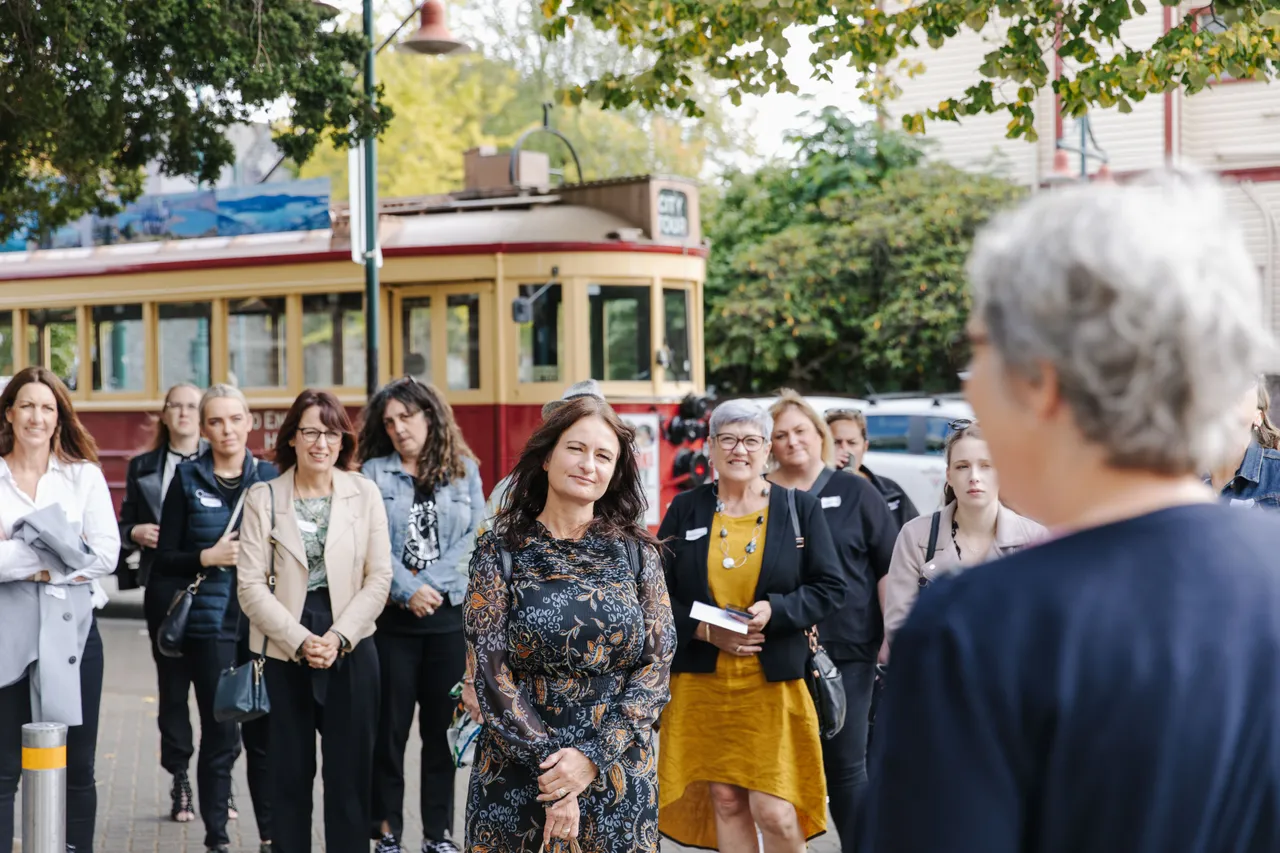 Meet Famil - Group with Tram in Background 