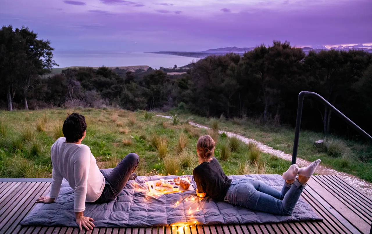 Couple admiring view from deck