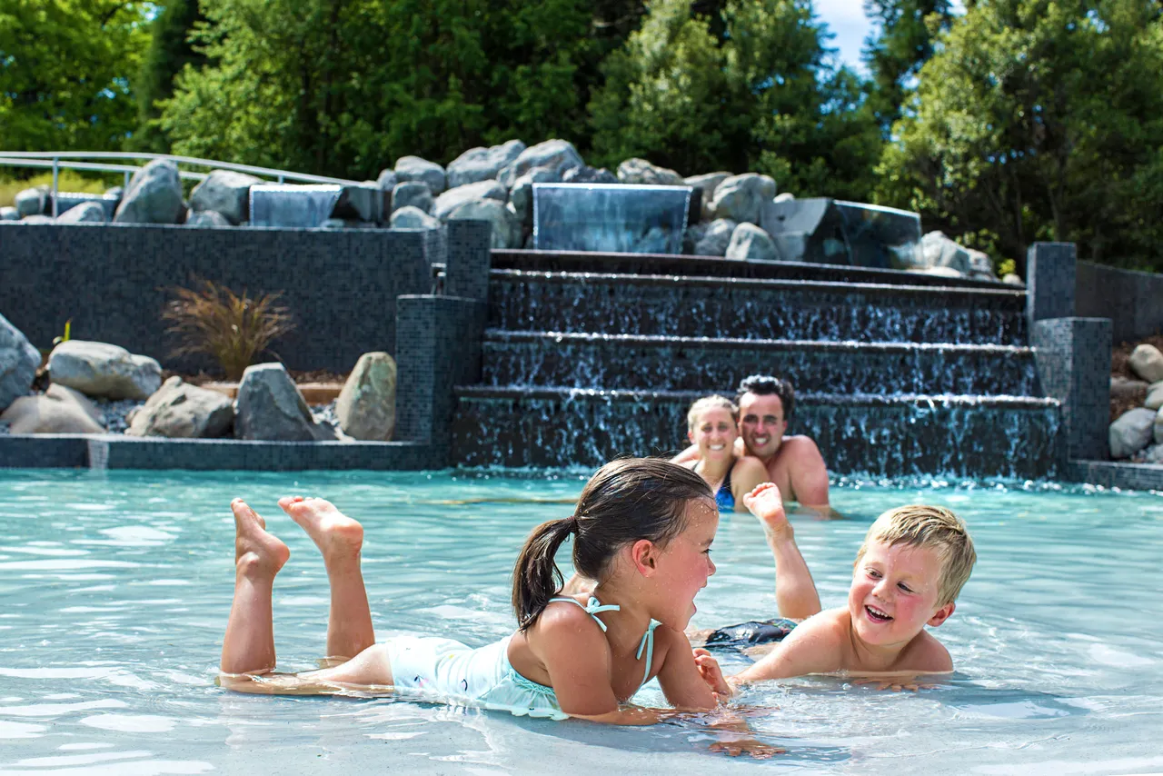 Family having fun at pools 