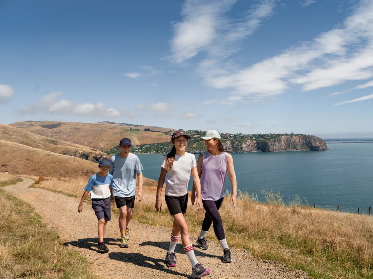 Family hiking at Godley Head Track