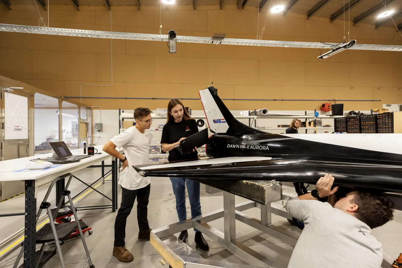 Engineers inspecting a spaceplane