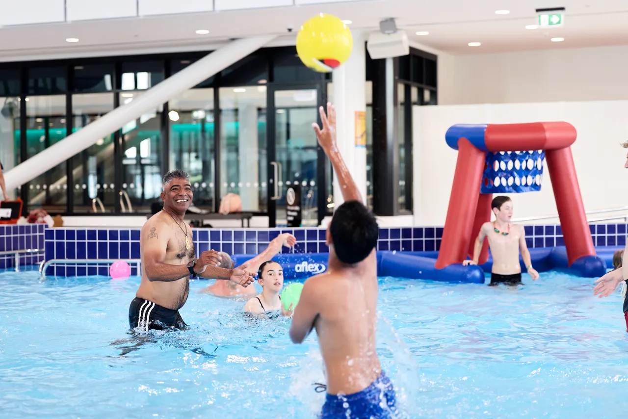 Family playing in pool at Parakiore