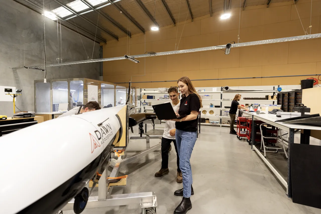 Engineers inspecting a spaceplane