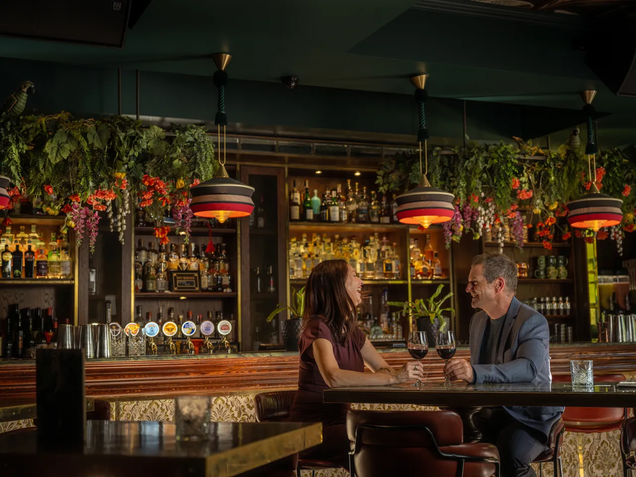 Couple enjoying food and drinks at Amazonita