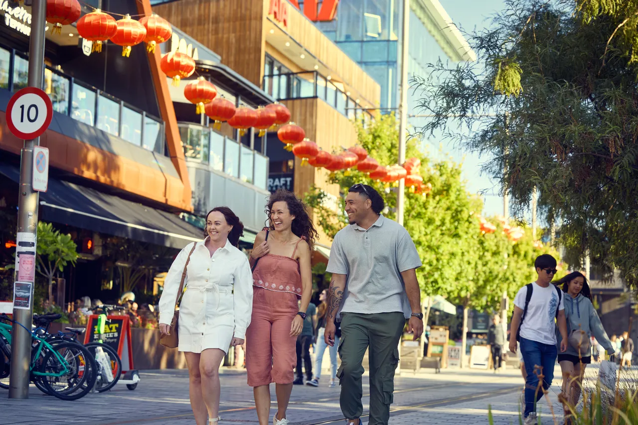 Friends strolling along Oxford Terrace