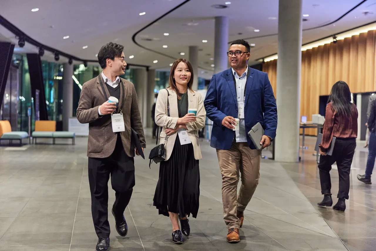 Conference participants walking 