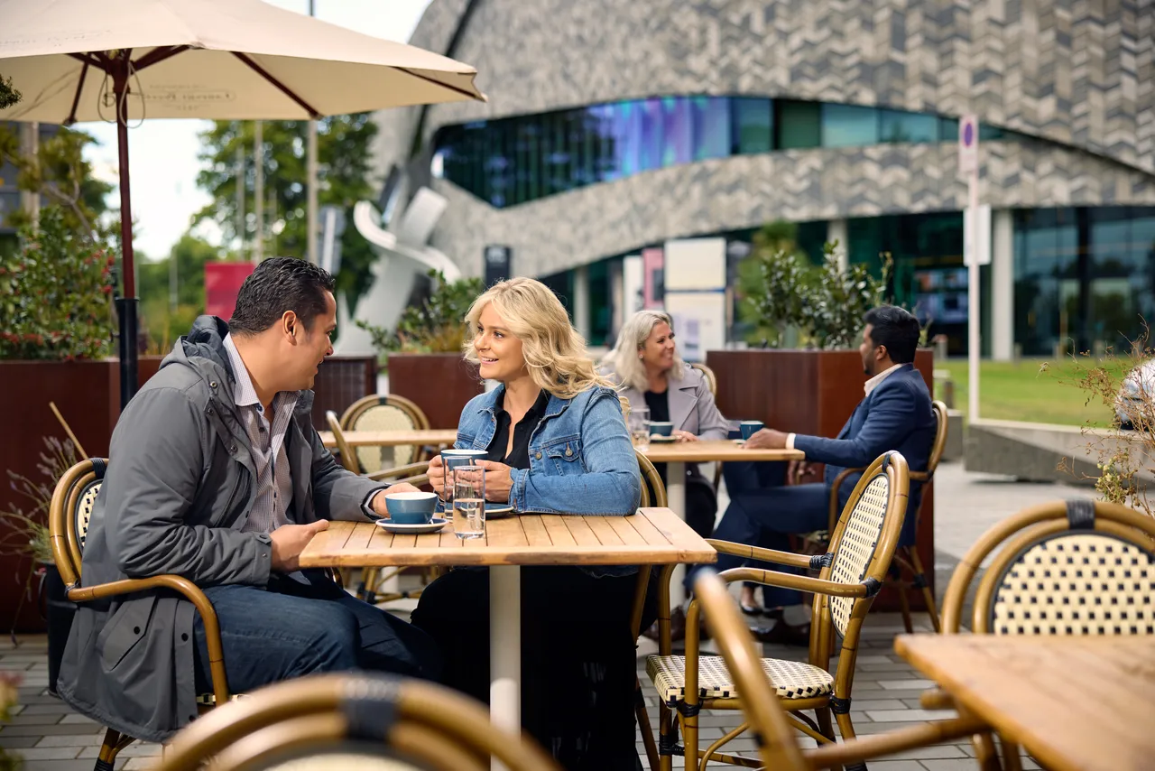 Couple enjoying coffee at Miro