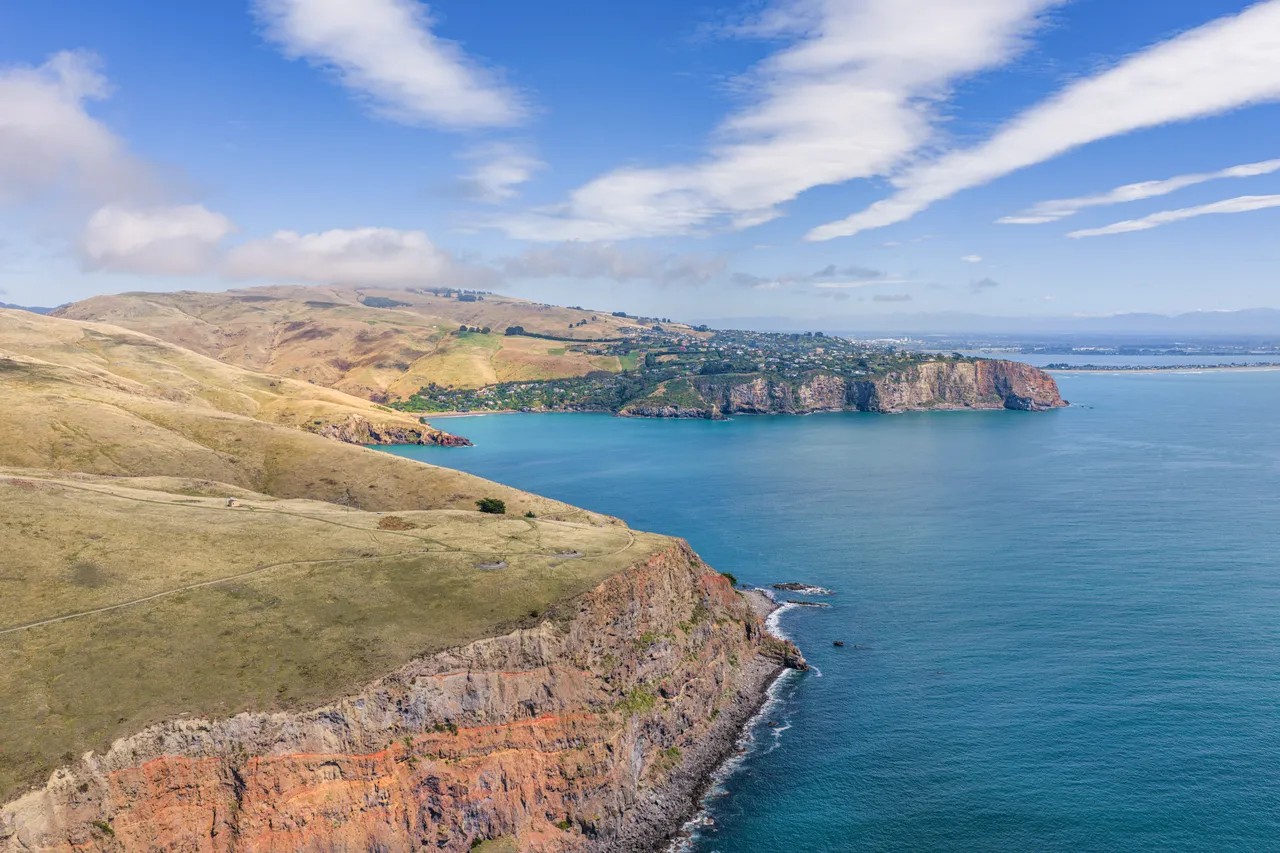 Group hiking at Godley Head Track aerial