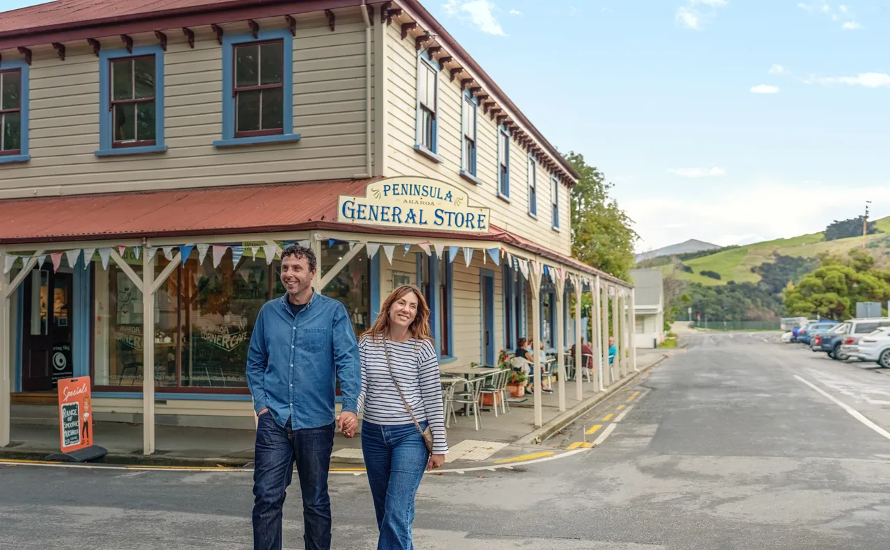 Couple walking in Akaroa