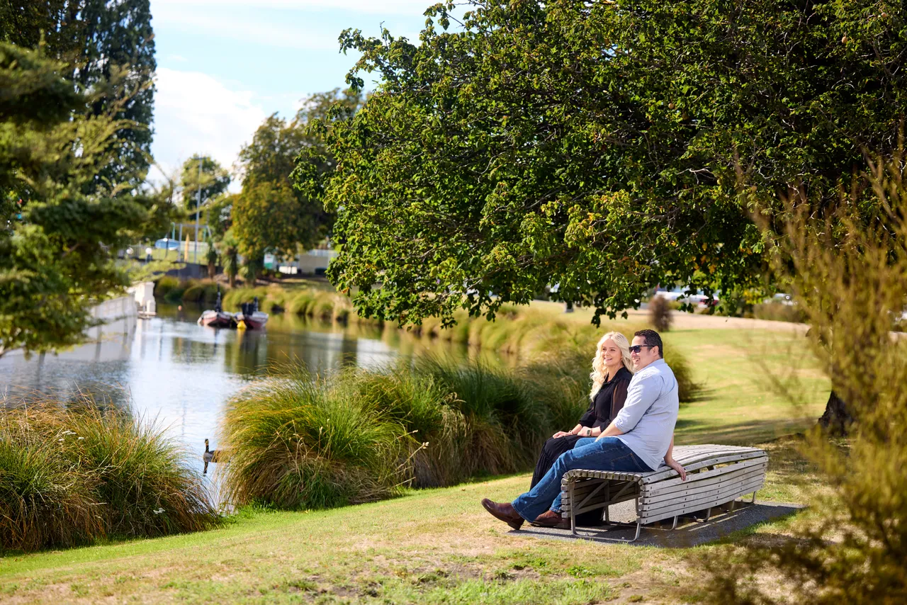 Couple enjoying the moment, gazing at the Avon River