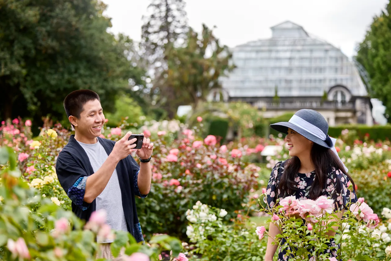 Couple taking a photo at the Rose Garden