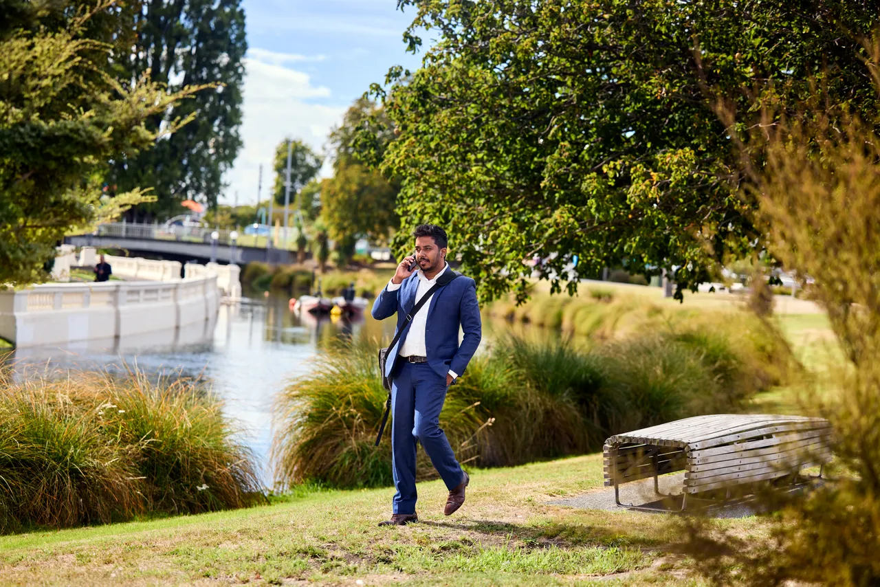 Man on the phone by the Avon River