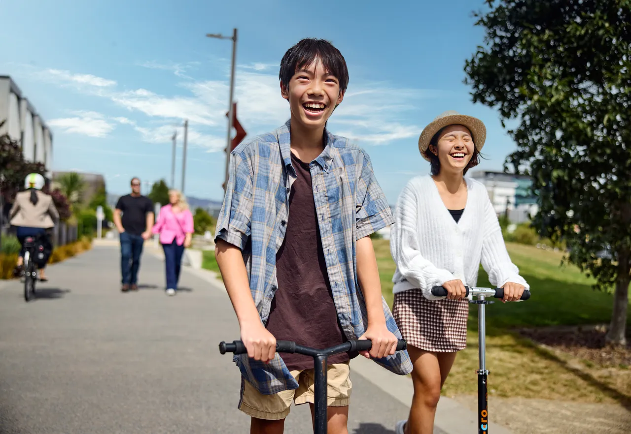 Teenagers on scooters at Rauora Park