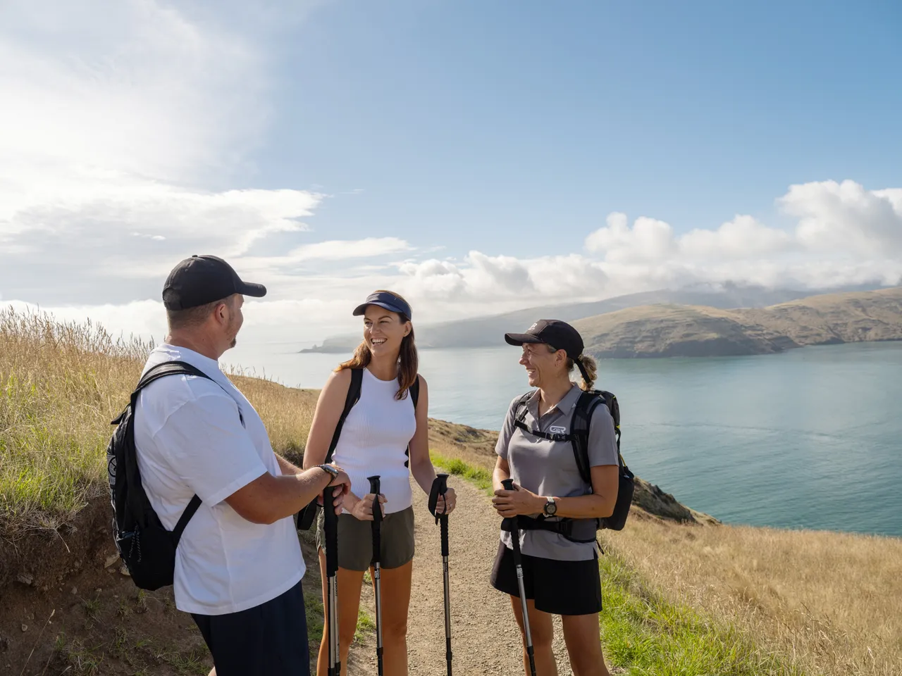 Couple hiking at Godley Head Track with Crater Rim Walks