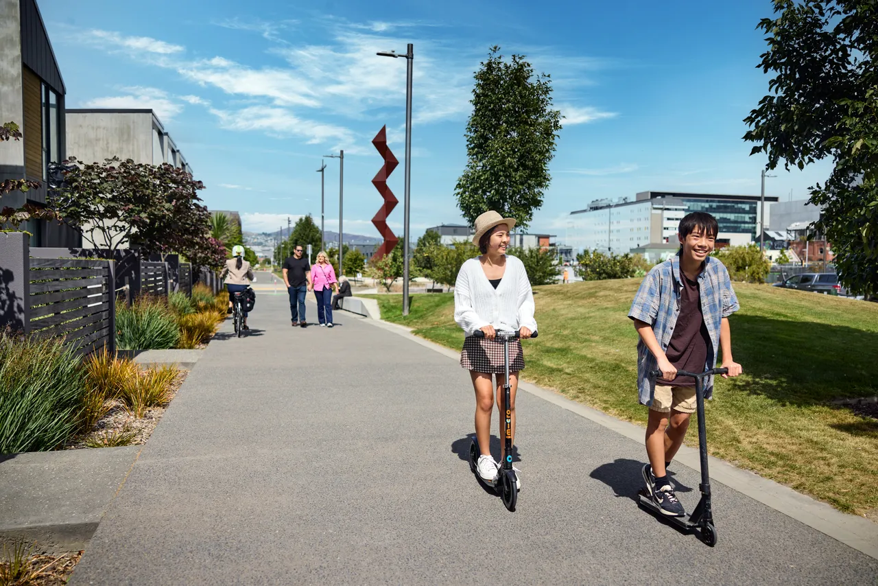 Teenagers on scooters at Rauora Park