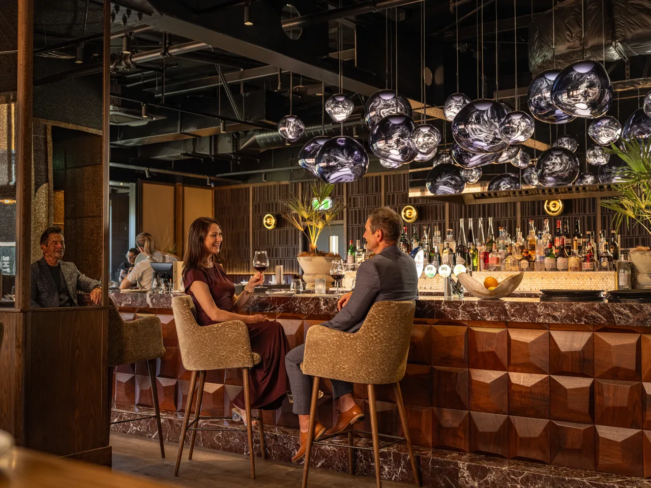 Couple enjoying food and drinks at Roca