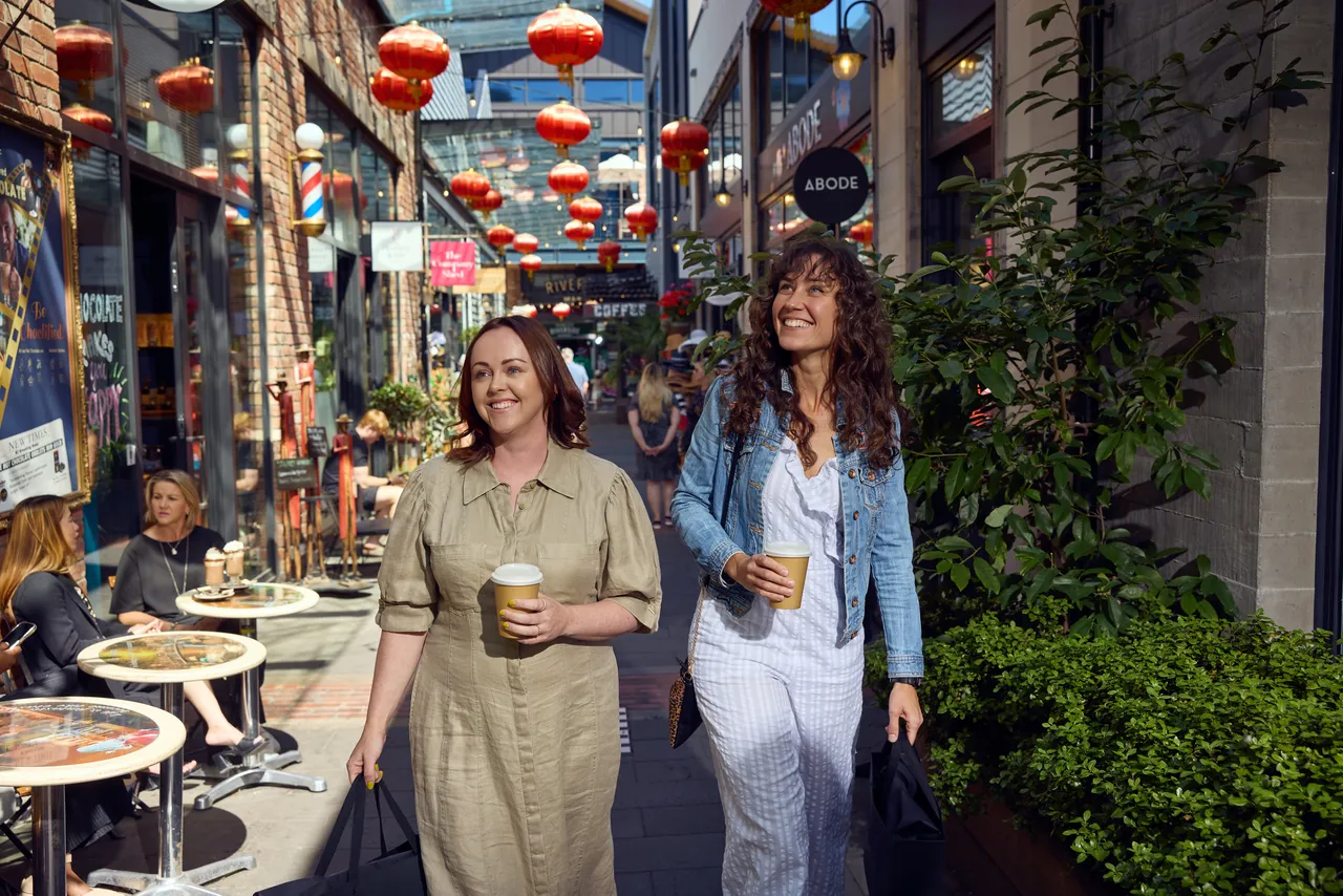Two friends explore shops at the Riverside Lanes