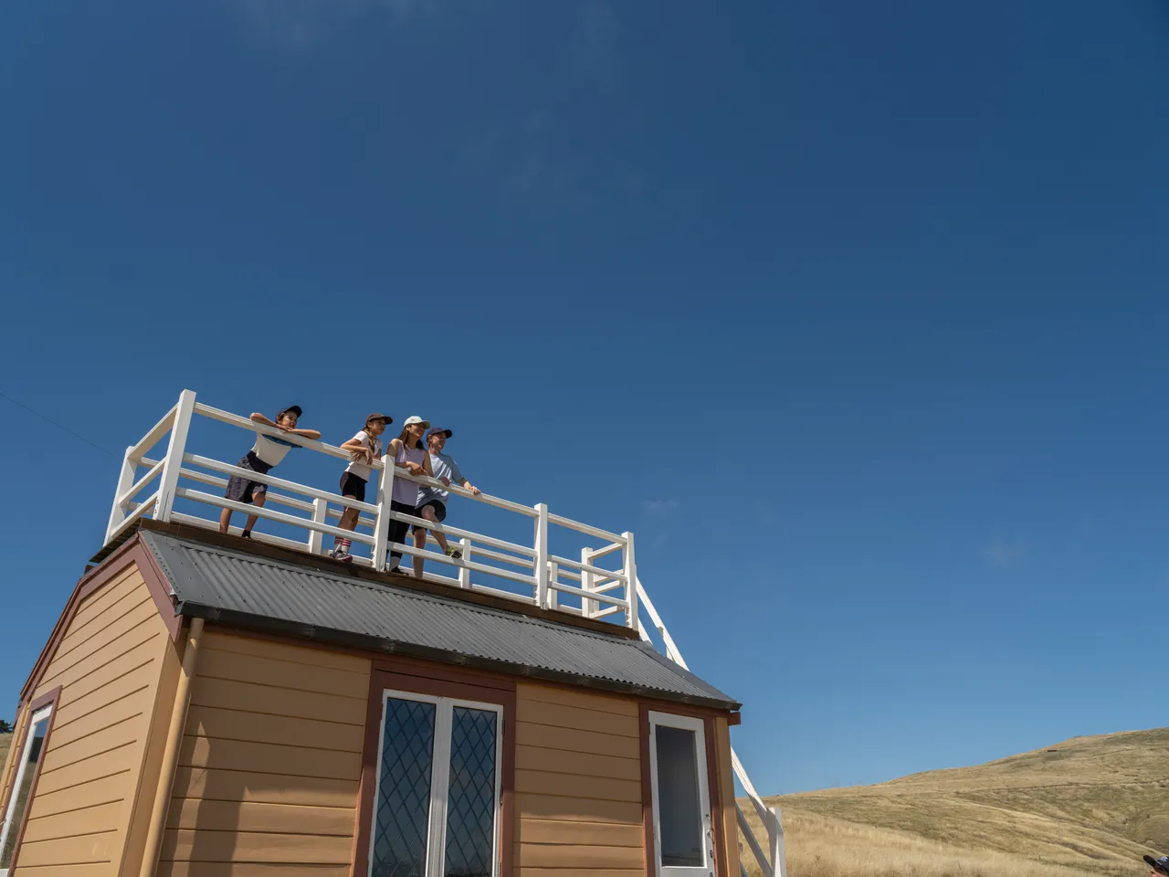 Family at Scott's Cabin in Godley Head