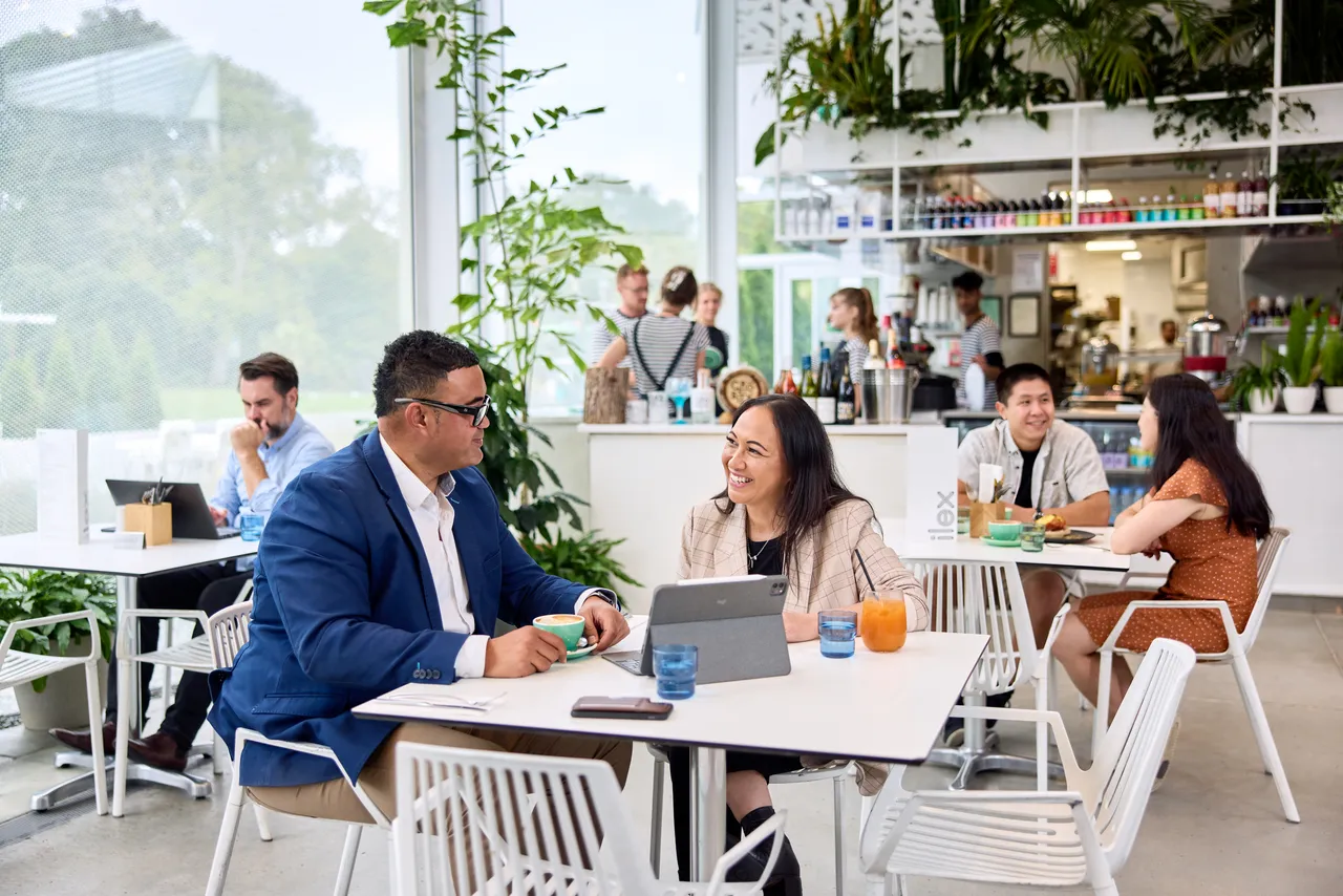 Colleagues having a breakfast meeting at Ilex Café